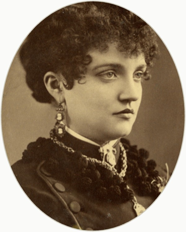 Oval-cropped studio portrait of Elizabeth Baby Doe Tabor in a dark dress, circa 1883